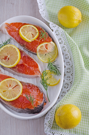 three steak fresh salmon, lying in a baking dishの写真素材