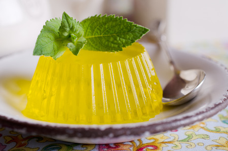 continental marmalade yellow with green mint leavesの写真素材