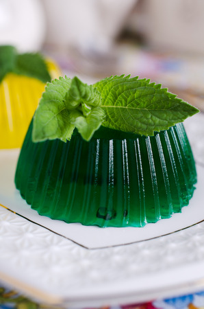 continental transparent jelly green and yellow with mint leavesの写真素材