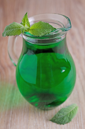 transparent green drink, poured into a carafe の写真素材