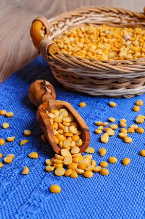 Seeds dried peas yellow lie in a wooden shovelの写真素材