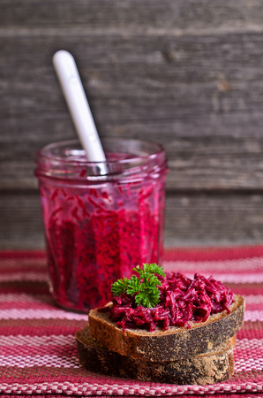 Sandwich with beet and parsley on a wooden Boardの写真素材