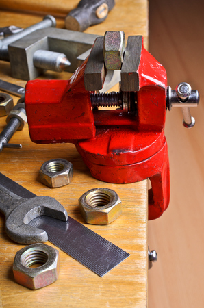 The vise to clamp on a wooden desktop environment toolsの写真素材