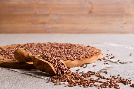 Whole raw grain unpolished brown rice in a potの写真素材