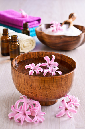 Flowers pink hyacinth in a ceramic bowl with water. Spa.の写真素材