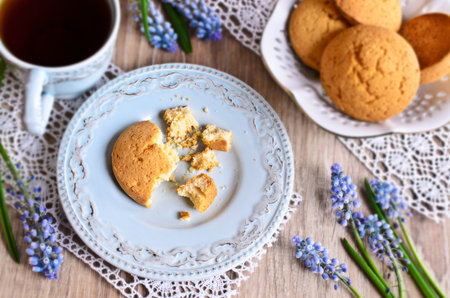 Oatmeal cookies round shape in a white ceramic vase on a wooden surface