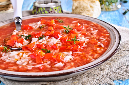 Soup red with rice, vegetables and thymeの写真素材