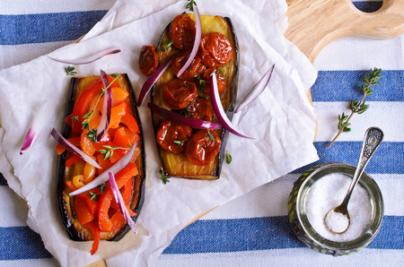 Half roasted eggplant with vegetables and thymeの写真素材
