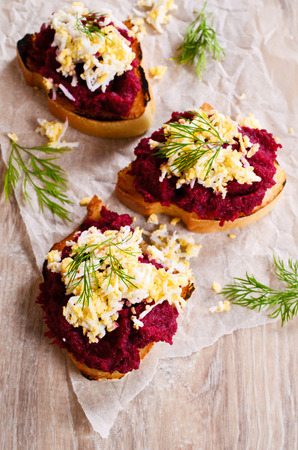 Sandwich with beetroot and egg in rustic styleの写真素材