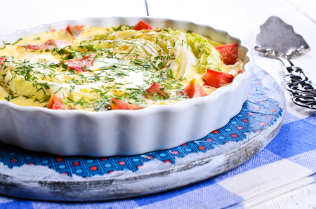 Casserole with vegetables and dill in a ceramic formの写真素材