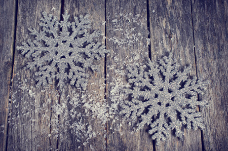 Christmas composition with decorations on wooden background in retro styleの写真素材