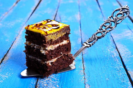 Cake square shaped chocolate cakes with cream filling and a glossy finishの写真素材