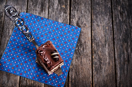 Chocolate cake with a shiny glaze and chocolate decorations. Selective focus.の写真素材