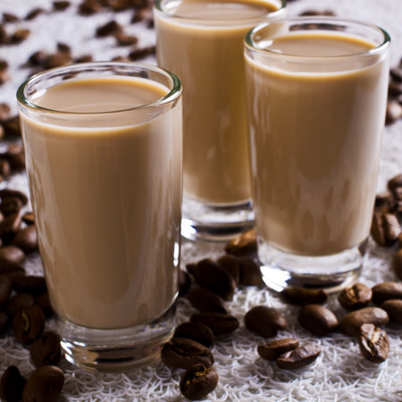 Cocktail of coffee and cream in a glass container. Selective focus