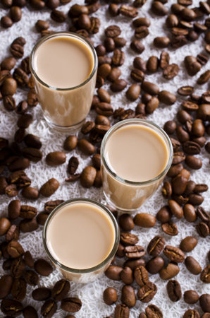 Cocktail of coffee and cream in a glass container. Selective focus