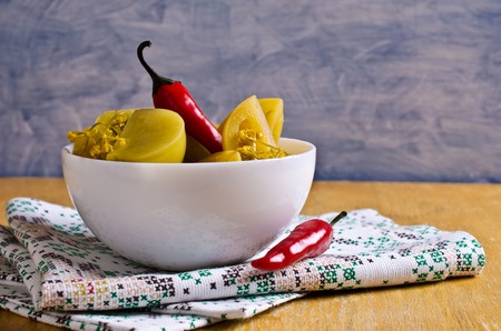 Canned green tomatoes, cut into pieces. Selective focus.の写真素材