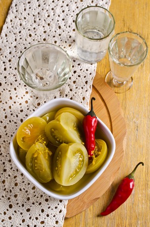Canned green tomatoes, cut into pieces. Selective focus.の写真素材