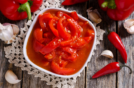 Red peppers marinated with chilli and garlic. Selective focus.の写真素材