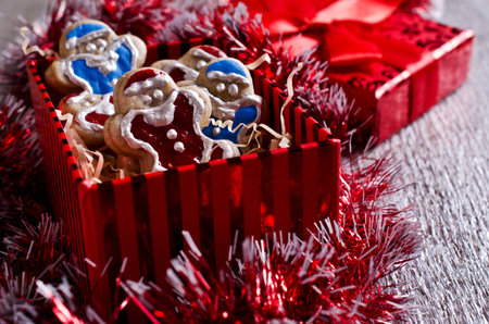 Christmas cookies with icing in a gift box. Selective focus.