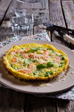 Omelet with shrimp and peas in a rustic style. Selective focus.の写真素材