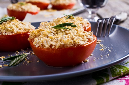 Tomatoes with crunchy sprinkles, baked in the oven. Selective focus.の写真素材