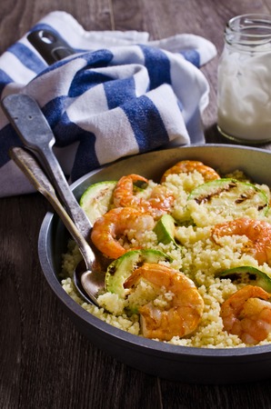 Couscous with grilled vegetables and shrimp. Selective focus.の写真素材