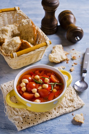 Clear soup with vegetables and chickpeas. Selective focus.の写真素材