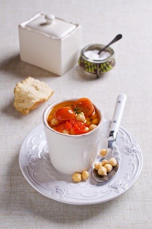 Clear soup with vegetables and chickpeas. Selective focus.の写真素材