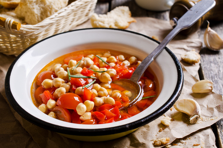Clear soup with vegetables and chickpeas. Selective focus.の写真素材