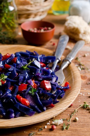 Steamed vegetables with spices on rustic wooden background. Selective focus.の写真素材