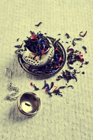 Dry black tea with flower petals. Selective focus.の写真素材