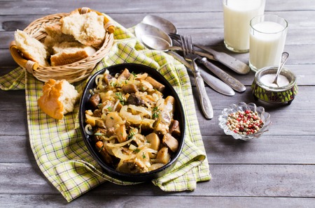Cooked wild mushrooms with onion and thyme. Selective focus.の写真素材