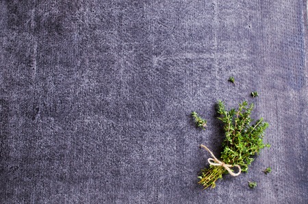 Bunch of fresh thyme on a dark background. Selective focus.の写真素材