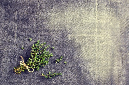 Bunch of fresh thyme on a dark background. Selective focus.の写真素材