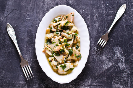 Appetizer of squid in a spicy marinade. Selective focus.の写真素材