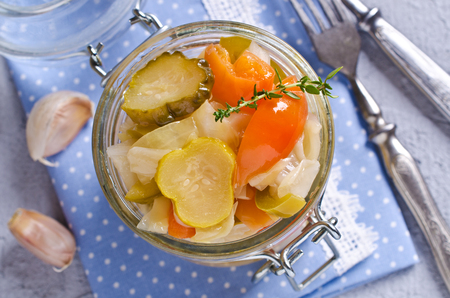 Homemade canned vegetables in the marinade. Selective focus.の写真素材