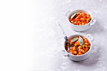 Chickpeas cooked with vegetable sauce. Selective focus.の写真素材