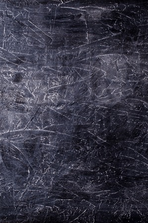 Gray concrete background with cracks and irregularities. Selective focus.の写真素材