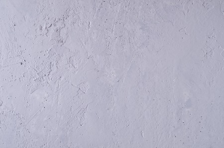 Gray concrete background with cracks and irregularities. Selective focus.の写真素材