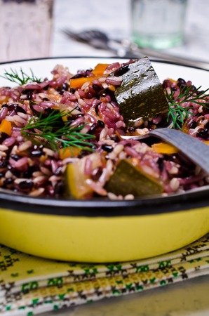 Cooked rice with vegetables and sauce on the plate. Selective focus.の写真素材