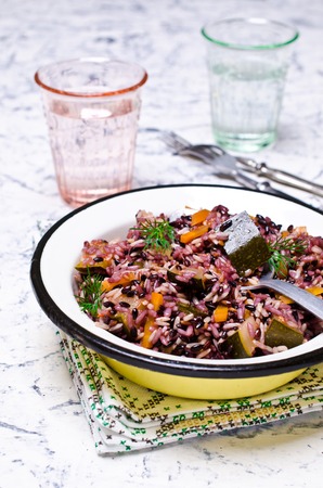 Cooked rice with vegetables and sauce on the plate. Selective focus.の写真素材
