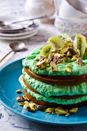 Sponge cake diet with green cream. Selective focus.の写真素材