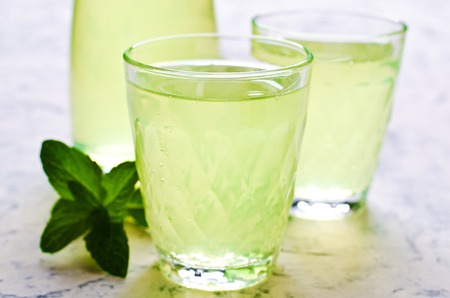 Cold drink with mint in a glass on a concrete background. Selective focus.の写真素材