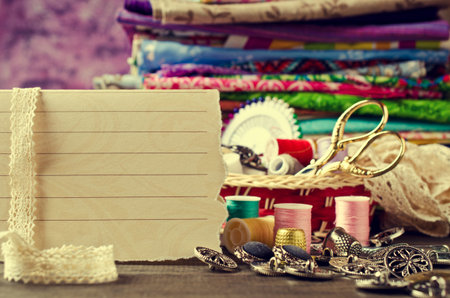 Blank form for writing text on background tailor accessories. Selective focus.
