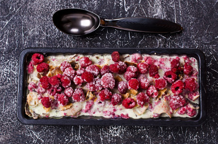 Ice cream with raspberries and waffles on a dark background. Selective focus.の写真素材