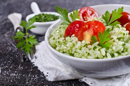 Salad with rice, tomato and green sauce. Selective focus.の写真素材