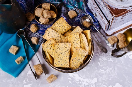 Cookies from puff pastry with poppy seeds and sugar. Selective focus.の写真素材
