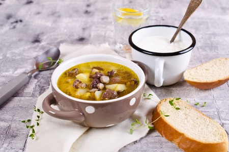 Soup with mushrooms and vegetables in a rustic style. Selective focus.の写真素材
