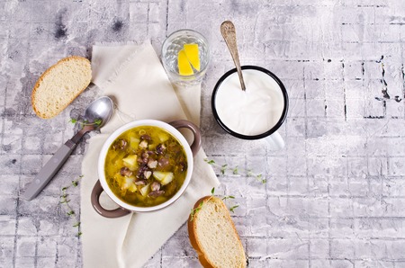 Soup with mushrooms and vegetables in a rustic style. Selective focus.の写真素材