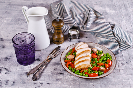 Fried chicken breast with vegetables on on light  background. Selective focus.の写真素材